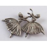 A silver brooch designed as two ballerinas, hallmarked Birmingham 1948, approx 4.5 x 3.5cm.