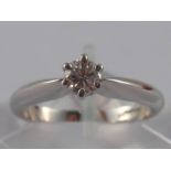 An 18 carat white gold diamond solitaire ring,