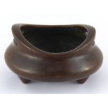 A bronze Chinese censer of conventional form on three stub feet. Four character mark to base. 12cm.