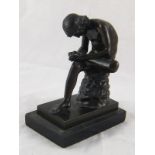 A copy of the classical Graeco-Roman bronze of a naked boy removing a thorn from his foot. Ht. 17cm.