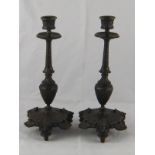 A pair of Art Nouveau bronze candlesticks,