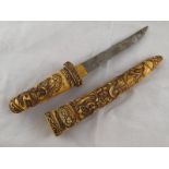A large Oriental dagger with well carved ivory grip and scabbard. Possibly Tibetan, circa 1900.
