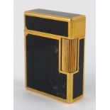 An S.T. Dupont gold plate and lacquer cigarette lighter with Chinese character marks, approx 4.