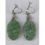 A pair of carved jadeite drop earrings, jades approx 26 x 18mm.