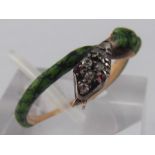 An antique gold and enamel snake ring, with diamond and ruby set head,