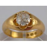 An 18 carat gold diamond solitaire ring, the old brilliant cut diamond measuring approx 6.6 x 7.