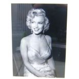 Two framed studio photographs of Marilyn Monroe,