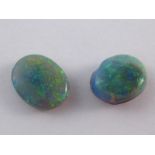 Two loose polished opals, total weight approx 0,5 gms (2.5 carats), larger stone approx 7.3 x 9.