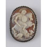 A cameo of St George and the Dragon, in silver brooch mount. 5x3.5cm.