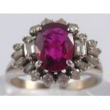 A ruby and diamond ring, accompanied by IGL report number J82366170EN stating “Natural Corundum,