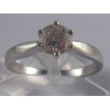 An 18 carat white gold diamond solitaire ring, the round brilliant cut diamond measuring approx 5.