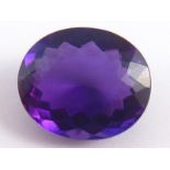 A loose polished amethyst, approx 19.4 x 16.5mm, 3.5 gms (approx 17.5 carats).