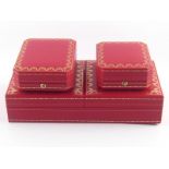 Cartier. A pen box and two jewellery boxes.