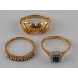 A mixed lot comprising three 9 carat gold rings, two set with diamonds, sizes M-N, gross weight 7.