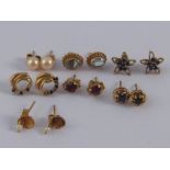 A mixed lot comprising seven pairs of 9 carat gold and yellow metal (tests 9 carat gold) ear studs.
