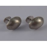 A pair of white metal (tests silver) diamond cufflinks, approx 17 x 12mm12.1 gms.
