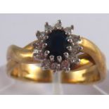 A 9 carat gold sapphire and diamond ring, sapphire approx 5 x 4 mm, ring size O, 4.3 gms.