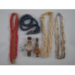 A mixed lot comprising four necklaces including one with gold clasp,