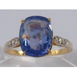 A yellow metal (tests 18 carat gold) sapphire and diamond ring,