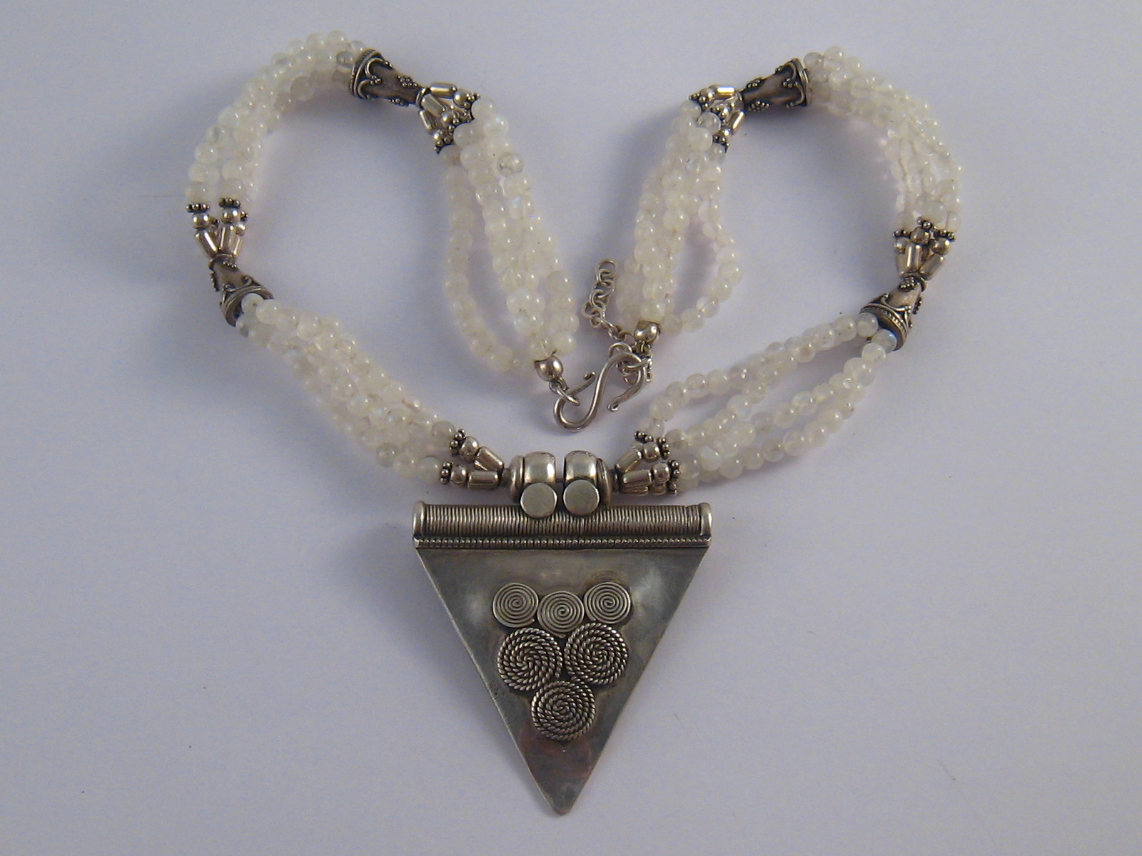 A white metal (tests silver) and moonstone necklace, central pendant approx 6cm,