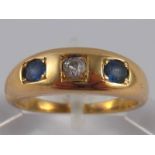 A yellow metal (tests 18 carat gold) old brilliant cut diamond and sapphire ring, size M, 5.4 gms.