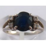 A white metal (tests 14 carat gold) sapphire and diamond ring, sapphire approx 7.