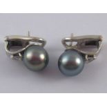 A pair of white metal (tests 18 carat gold) grey cultured pearl and diamond earrings,