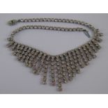 An Art Deco style paste set fringe necklace, approx 40cm long, 5cm drop.