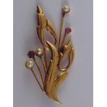 A yellow metal (tests 18 carat gold) ruby and cultured pearl floral brooch, approx 7cm, 12.6 gms.