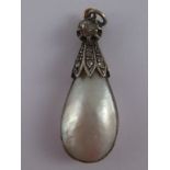 An antique silver, mabe pearl and rose cut diamond pendant with gold top ring, approx 3.5cm drop.