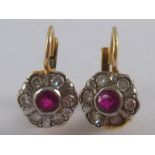 A pair of yellow metal (tests 18 carat gold) ruby and diamond earrings, approx 1.5cm drop, 2.5 gms.