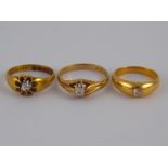 A mixed lot comprising three old brilliant cut diamond solitaire rings,