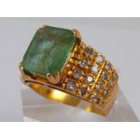 A yellow metal (tests 18 carat gold) emerald and diamond ring, emerald approx 10.5 x 9 x 4.
