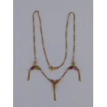 A yellow metal (tests 18 carat gold) gem set necklace, approx 43cm long, 4.6 gms.