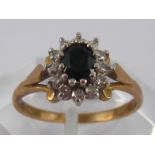 A 9 carat gold sapphire and diamond cluster ring, size N, 2.3 gms.