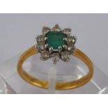 An 18 carat gold emerald and diamond ring, emerald approx 5 x 4mm,