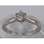 An 18 carat white gold diamond solitaire ring, the round brilliant cut diamond measuring approx 4.