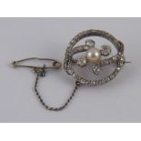 A rhodium plated 18 carat gold old brilliant cut diamond and untested pearl circle brooch,