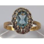 A 9 carat gold diamond and blue stone cluster ring, size N, 3.1 gms.