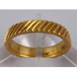 A part hallmarked 18 carat gold ring, signed Kutchinsky, size O, 5 gms.
