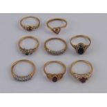A mixed lot comprising eight yellow metal (tests 9 carat gold) and hallmarked 9 carat gold rings,