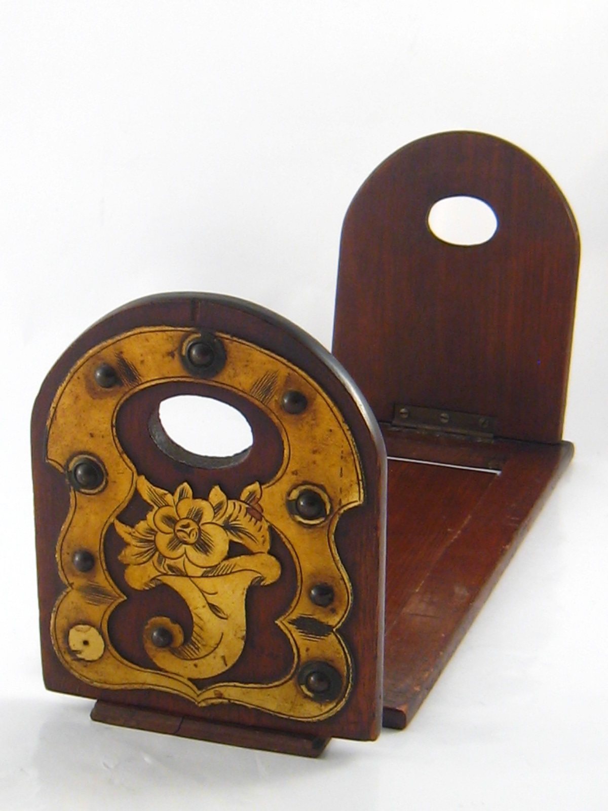 A Mahogany book slide with stud mounted brass decoration (AF). 12x32cm. closed.