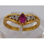 An 18 carat gold ruby and diamond ring, size M, 3.2 gms.