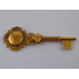 A large, fine ceremonial or Masonic gold key, marked 9ct Gold and with maker's mark JAW & Co,