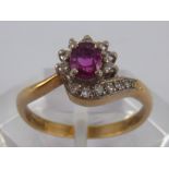 A 9 carat gold ruby and diamond ring, ruby approx 5 x 4 mm, ring size O, 2.5 gms.