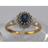 A 9 carat gold sapphire and diamond ring, sapphire approx 5 x 4mm, ring size M, 1.8 gms.