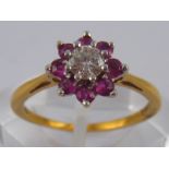 An 18 carat gold ruby and diamond ring,