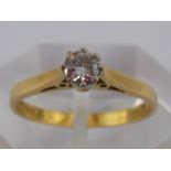 An 18 carat gold diamond solitaire ring,