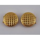 A pair of yellow metal (tests 18 carat gold) studs with clip fittings, approx 14mm diameter, 3.