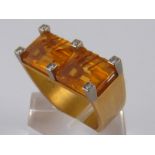 A French hallmarked 18 carat gold citrine and diamond ring of geometric modernist design, approx 2.